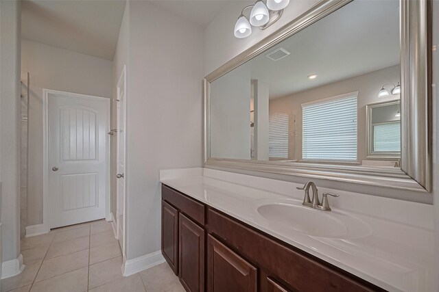 1718 Pepper Grove Ln, Katy, TX 77494 - bathroom featuring vanity, baseboards, and tile patterned floors