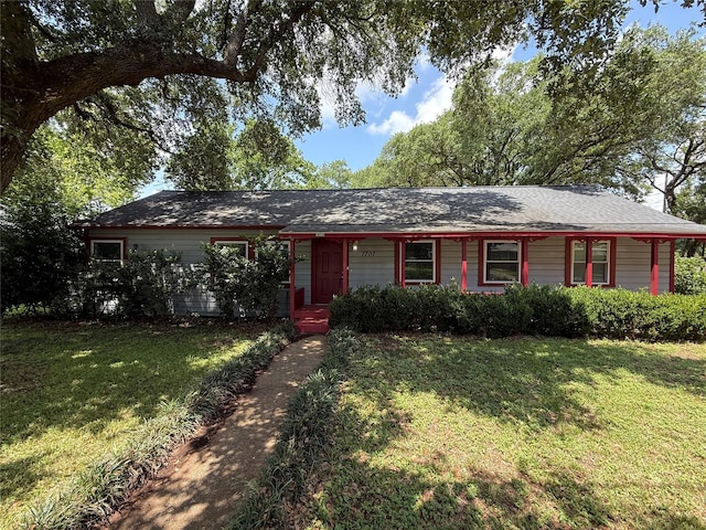 1707 Key St, Waller, TX 77484 - ranch-style home with a front yard and covered porch