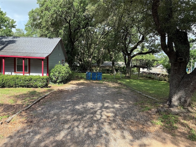 1707 Key St, Waller, TX 77484 - view of yard featuring covered porch and driveway
