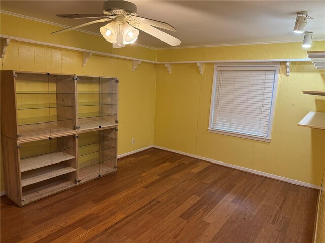 1707 Key St, Waller, TX 77484 - unfurnished bedroom featuring wood finished floors, baseboards, and crown molding