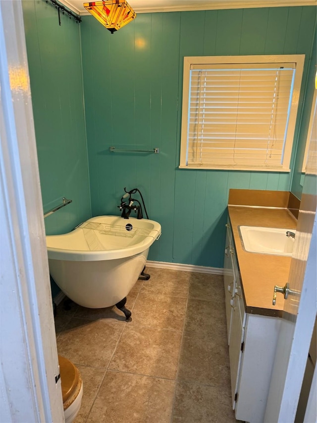 1707 Key St, Waller, TX 77484 - bathroom with a freestanding bath, vanity, and baseboards