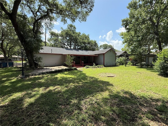 1707 Key St, Waller, TX 77484 - view of green lawn with covered porch