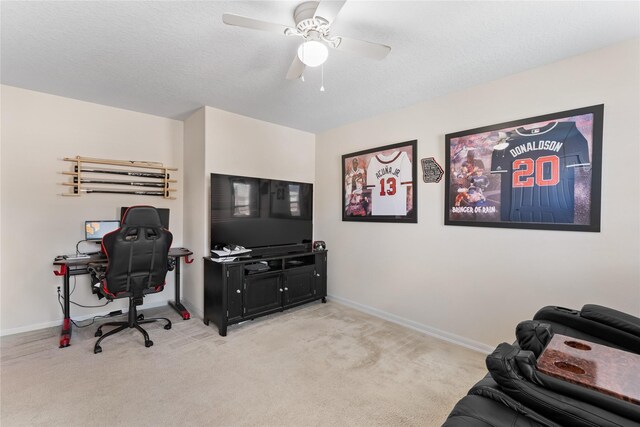 9915 Chimney Swift Ln, Conroe, TX 77385 - home office featuring light colored carpet, baseboards, and a ceiling fan