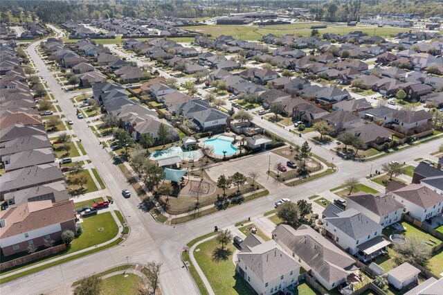 9915 Chimney Swift Ln, Conroe, TX 77385 - aerial overview of property's location featuring a pool area and nearby suburban area