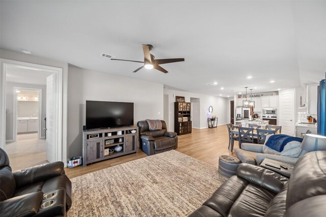 512 Highland Thicket Dr, Montgomery, TX 77316 - living area with a ceiling fan, light wood-type flooring, recessed lighting, and baseboards