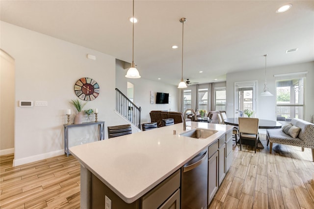 12347 Sabine Point Dr, Humble, TX 77346 - kitchen featuring open floor plan, dishwasher, light wood-type flooring, a sink, and recessed lighting