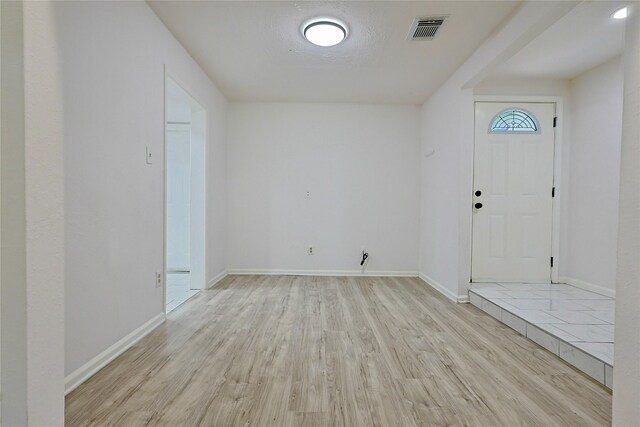 9910 Kent Towne Ln, Sugar Land, TX 77498 - entrance foyer featuring light wood-type flooring and baseboards