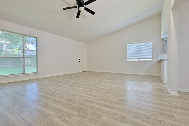 9910 Kent Towne Ln, Sugar Land, TX 77498 - spare room featuring vaulted ceiling, a ceiling fan, baseboards, and light wood-style flooring