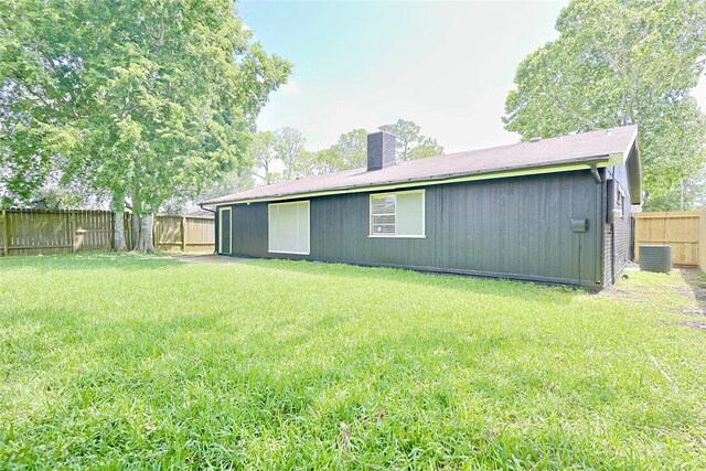9910 Kent Towne Ln, Sugar Land, TX 77498 - back of house with a chimney and central AC