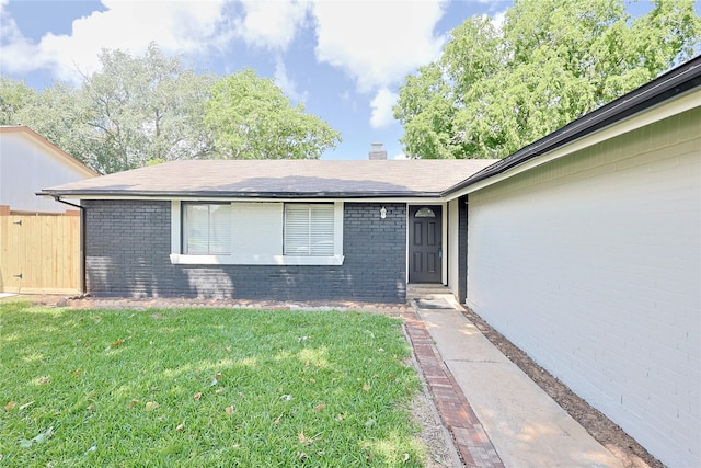 9910 Kent Towne Ln, Sugar Land, TX 77498 - property entrance with a lawn, brick siding, and a chimney