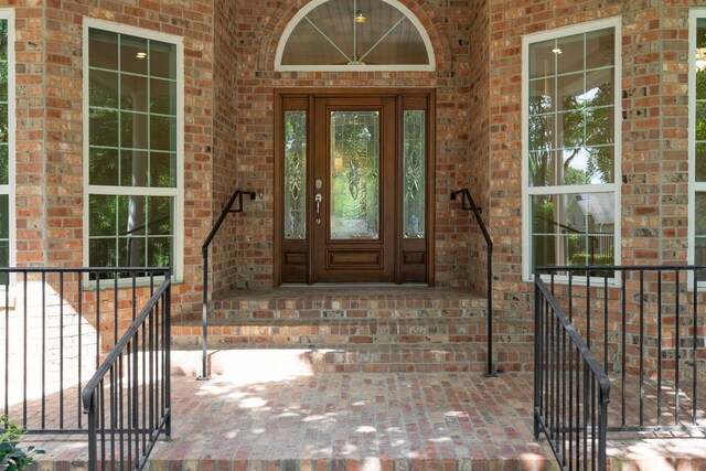 110 Canterbury Green Dr, Conroe, TX 77356 - property entrance featuring brick siding