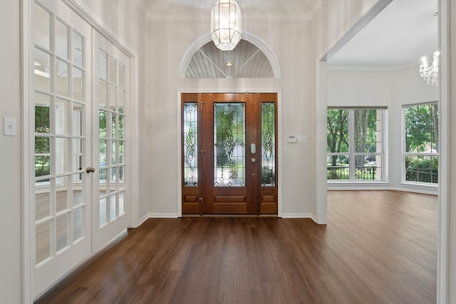 110 Canterbury Green Dr, Conroe, TX 77356 - entrance foyer featuring a chandelier, dark wood-type flooring, ornamental molding, and french doors