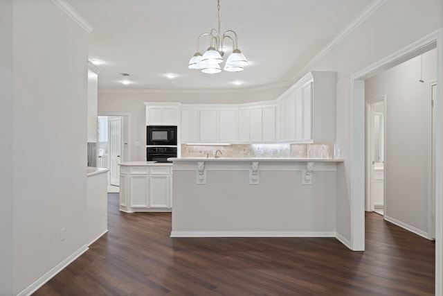110 Canterbury Green Dr, Conroe, TX 77356 - kitchen featuring black appliances, a kitchen bar, dark wood-style flooring, decorative backsplash, and ornamental molding