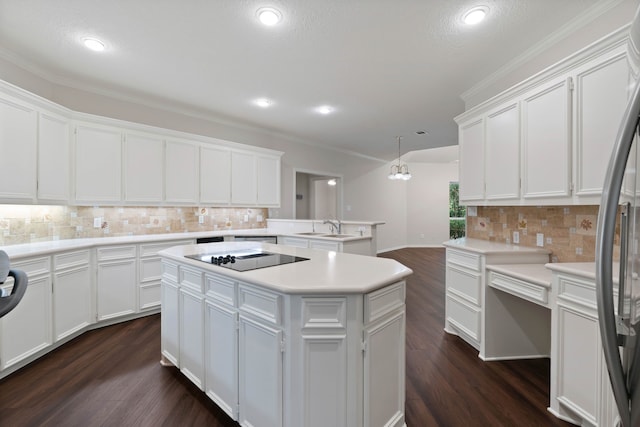 110 Canterbury Green Dr, Conroe, TX 77356 - kitchen featuring black electric cooktop, backsplash, stainless steel fridge, dark wood-style floors, and white cabinets