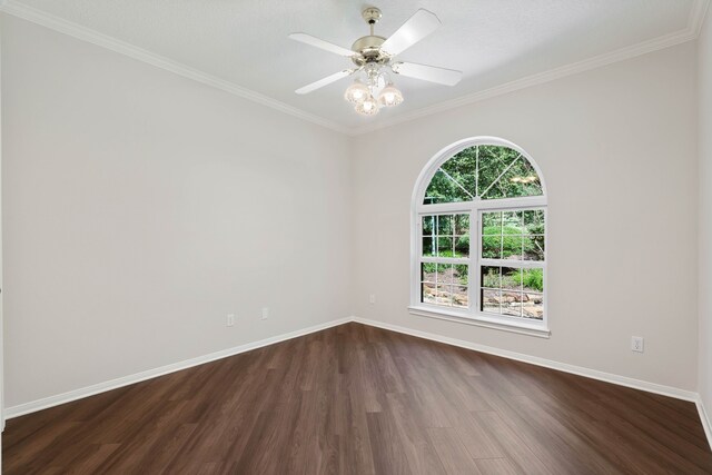 110 Canterbury Green Dr, Conroe, TX 77356 - spare room featuring dark wood-style floors, ornamental molding, and a ceiling fan