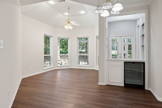110 Canterbury Green Dr, Conroe, TX 77356 - unfurnished dining area featuring beverage cooler, dark wood-style floors, a chandelier, ceiling fan, and recessed lighting