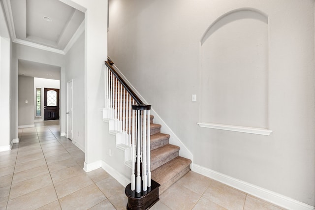 18738 Fox Kestrel Trl, Cypress, TX 77429 - stairs with tile patterned flooring, baseboards, and ornamental molding