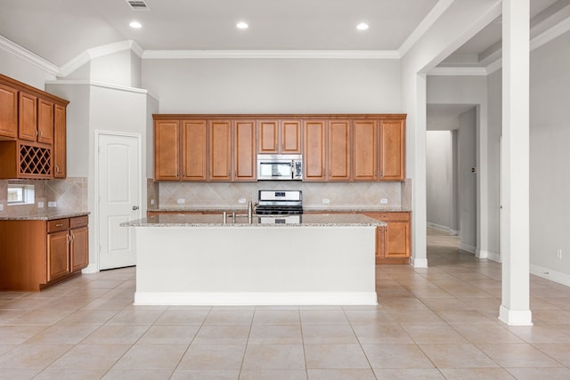 18738 Fox Kestrel Trl, Cypress, TX 77429 - kitchen with appliances with stainless steel finishes, brown cabinets, light tile patterned flooring, tasteful backsplash, and crown molding