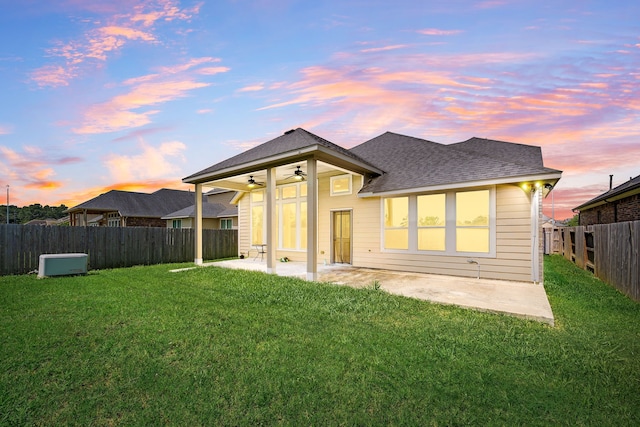 18738 Fox Kestrel Trl, Cypress, TX 77429 - back of property featuring ceiling fan, a shingled roof, and a patio area