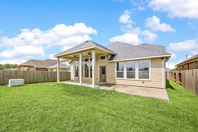 18738 Fox Kestrel Trl, Cypress, TX 77429 - rear view of house with a ceiling fan, roof with shingles, and a patio area