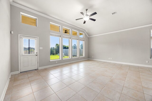 18738 Fox Kestrel Trl, Cypress, TX 77429 - spare room featuring ornamental molding, vaulted ceiling, ceiling fan, light tile patterned floors, and baseboards