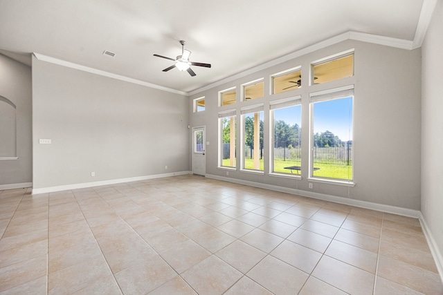 18738 Fox Kestrel Trl, Cypress, TX 77429 - unfurnished room with crown molding, plenty of natural light, a ceiling fan, light tile patterned floors, and baseboards
