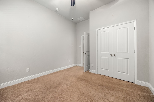 18738 Fox Kestrel Trl, Cypress, TX 77429 - unfurnished bedroom featuring light carpet, baseboards, a closet, and ceiling fan