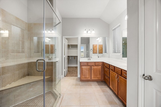 18738 Fox Kestrel Trl, Cypress, TX 77429 - bathroom with vanity, a shower stall, tile patterned flooring, lofted ceiling, and a spacious closet