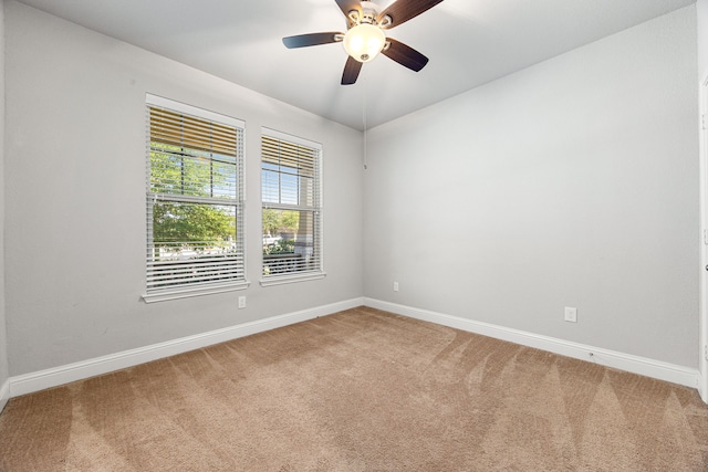 18738 Fox Kestrel Trl, Cypress, TX 77429 - spare room featuring light colored carpet, baseboards, and a ceiling fan