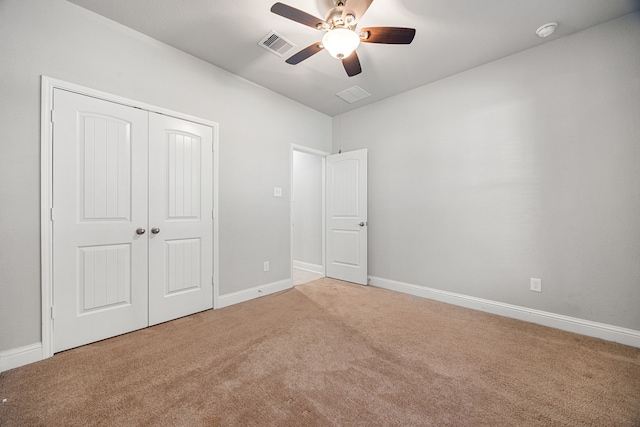 18738 Fox Kestrel Trl, Cypress, TX 77429 - unfurnished bedroom featuring carpet flooring, a closet, baseboards, and a ceiling fan