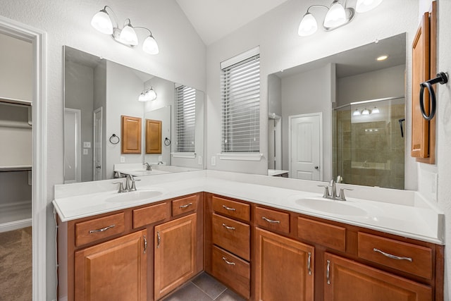 18738 Fox Kestrel Trl, Cypress, TX 77429 - full bath featuring vaulted ceiling, a shower stall, and double vanity