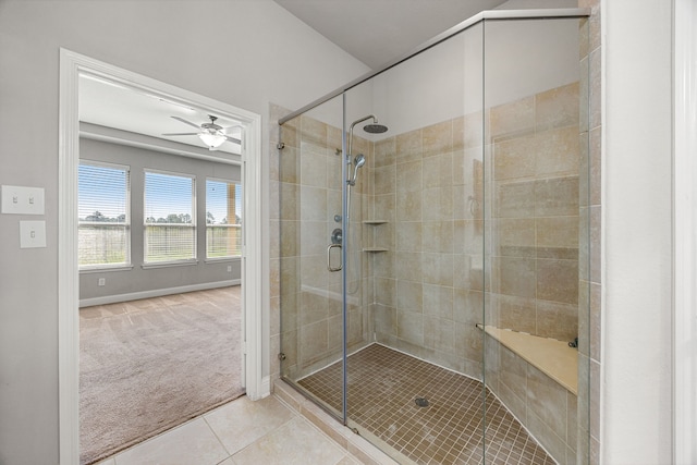 18738 Fox Kestrel Trl, Cypress, TX 77429 - full bathroom with tile patterned flooring, a stall shower, a ceiling fan, and baseboards