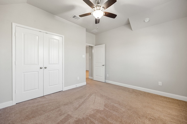 18738 Fox Kestrel Trl, Cypress, TX 77429 - unfurnished bedroom featuring carpet, a closet, baseboards, a ceiling fan, and vaulted ceiling