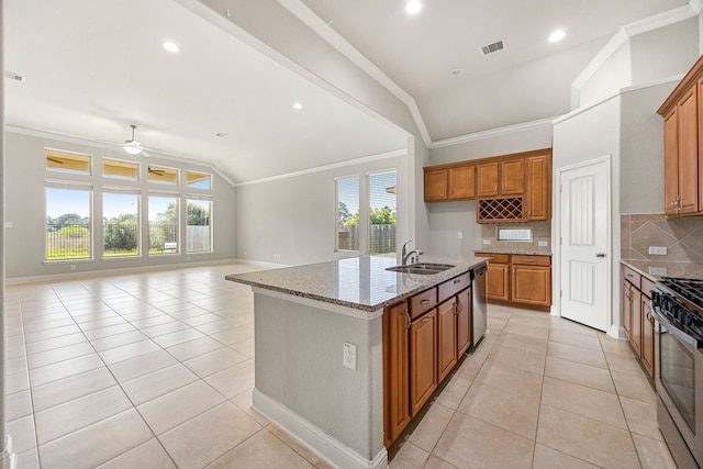 18738 Fox Kestrel Trl, Cypress, TX 77429 - kitchen with a sink, stainless steel appliances, brown cabinets, ornamental molding, and light tile patterned floors