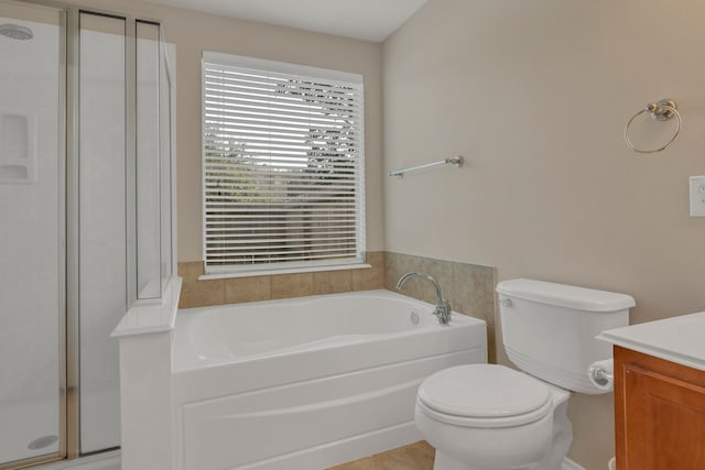 4609 Woodspring Acres Ct, Kingwood, TX 77345 - bathroom featuring vanity, a garden tub, a stall shower, and toilet