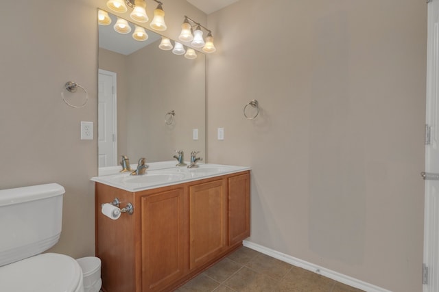 4609 Woodspring Acres Ct, Kingwood, TX 77345 - bathroom featuring toilet, double vanity, and tile patterned flooring