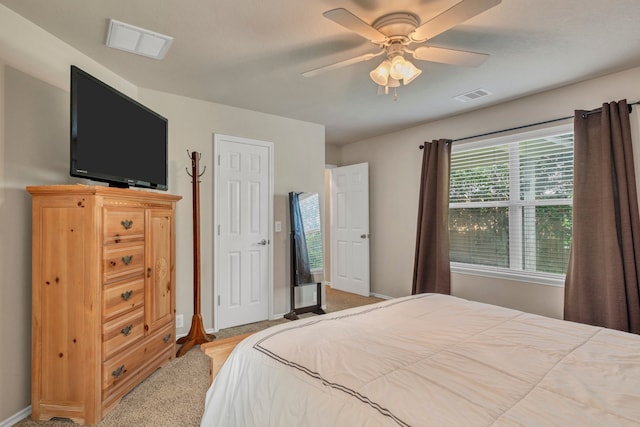 4609 Woodspring Acres Ct, Kingwood, TX 77345 - carpeted bedroom featuring baseboards and ceiling fan