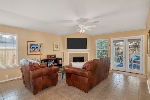 4609 Woodspring Acres Ct, Kingwood, TX 77345 - living area featuring light tile patterned floors, healthy amount of natural light, french doors, and lofted ceiling