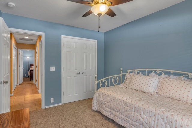 4609 Woodspring Acres Ct, Kingwood, TX 77345 - bedroom featuring a closet, baseboards, a ceiling fan, and carpet flooring