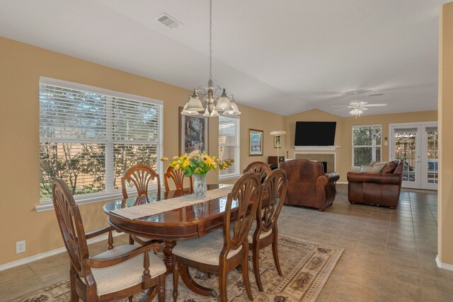 4609 Woodspring Acres Ct, Kingwood, TX 77345 - dining space featuring healthy amount of natural light, a chandelier, light tile patterned floors, ceiling fan, and lofted ceiling