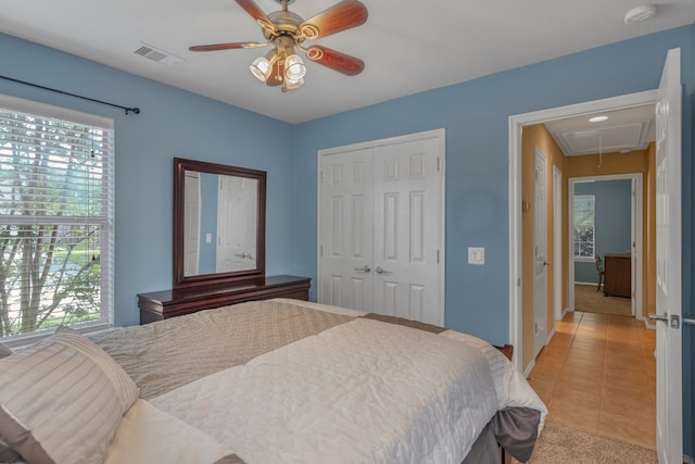 4609 Woodspring Acres Ct, Kingwood, TX 77345 - bedroom featuring attic access, multiple windows, and light colored carpet