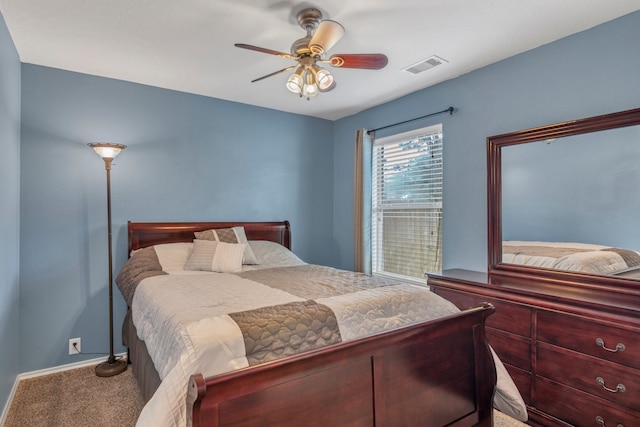 4609 Woodspring Acres Ct, Kingwood, TX 77345 - carpeted bedroom with baseboards and a ceiling fan