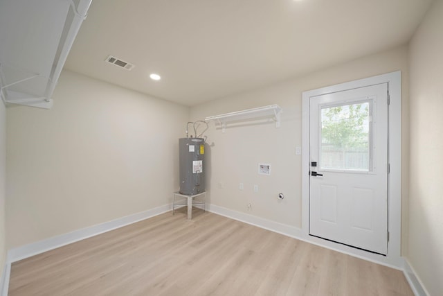 15322 E Barbara Cir, Houston, TX 77071 - washroom featuring water heater, light wood-type flooring, recessed lighting, and hookup for a washing machine