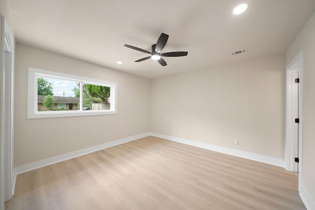15322 E Barbara Cir, Houston, TX 77071 - spare room featuring light wood-style floors, ceiling fan, and recessed lighting