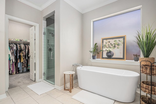 16618 S Swirling Cloud Ct, Cypress, TX 77433 - bathroom featuring a stall shower, a walk in closet, a freestanding bath, baseboards, and ornamental molding