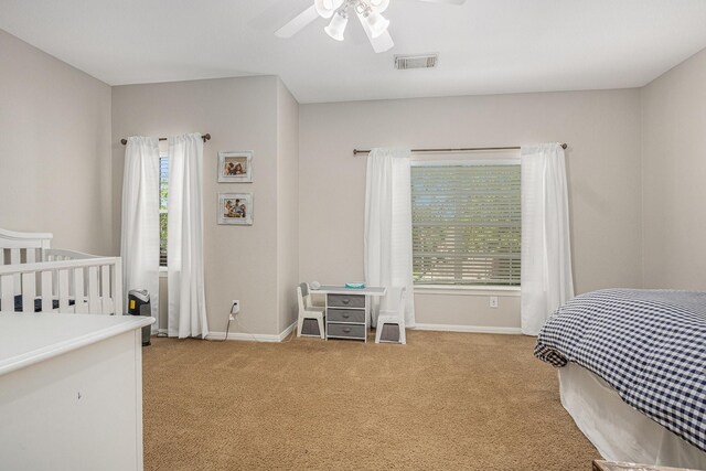 16618 S Swirling Cloud Ct, Cypress, TX 77433 - bedroom featuring light carpet, baseboards, and a ceiling fan