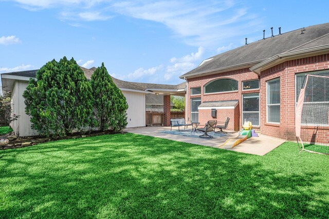 16618 S Swirling Cloud Ct, Cypress, TX 77433 - view of yard featuring a patio