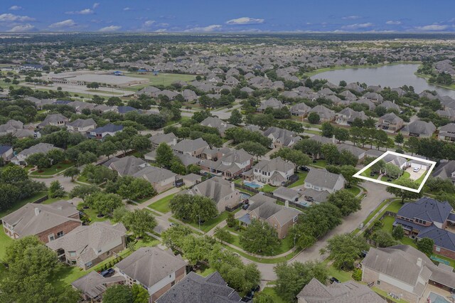 16618 S Swirling Cloud Ct, Cypress, TX 77433 - aerial perspective of suburban area with property parcel outlined and a large body of water