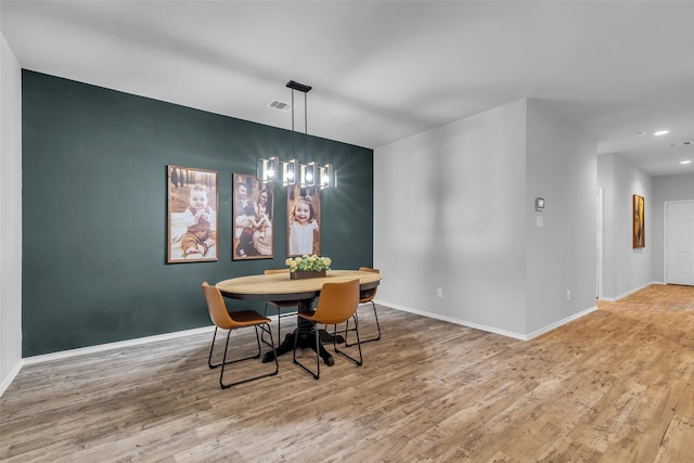 2322 Strong Horse Dr, Conroe, TX 77301 - dining room with wood finished floors, baseboards, and recessed lighting