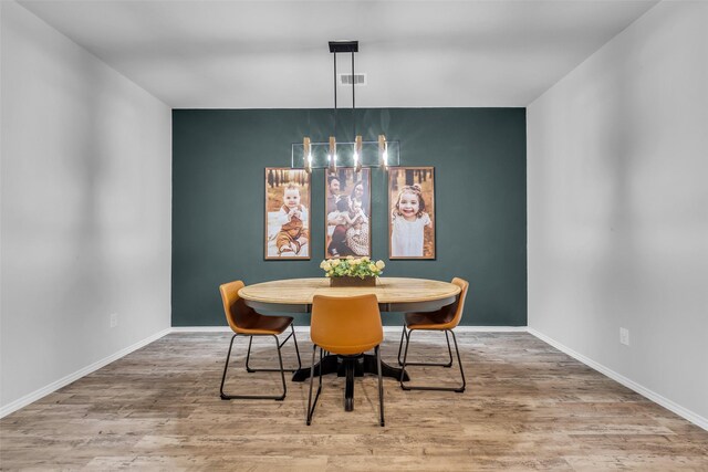 2322 Strong Horse Dr, Conroe, TX 77301 - dining space with wood finished floors and baseboards